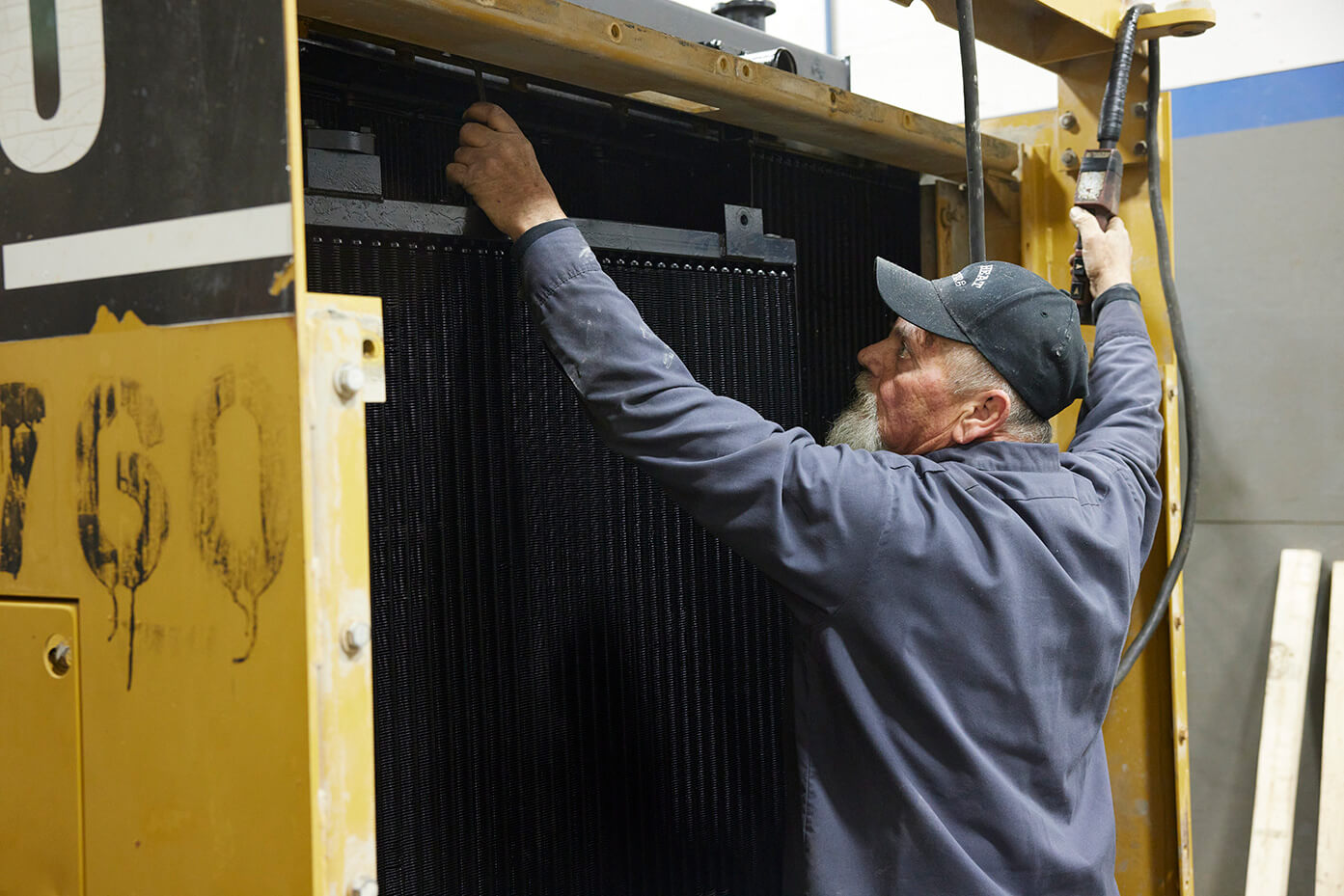 A worker assembling a heat transfer product